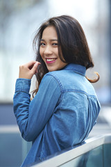 Fototapeta premium One beautiful young asian woman in the street