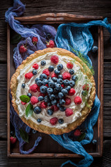 Homemade tart with fresh blueberries and raspberries