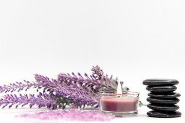 Obraz na płótnie Canvas Lavender aromatherapy Spa with rock amd candle. Thai Spa relax Treatments and massage white background. Healthy Concept. select and soft focus