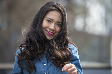 One beautiful young asian woman in the street