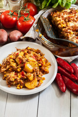 Portion of mexican potato casserole with minced meat