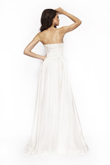 Brunette white dress posing