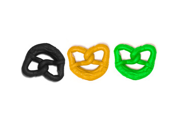 Pretzels in the colors of the jamaica flag. German Jamaica coalition. 