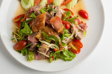 Roasted pork belly spicy salad isolated on white back ground