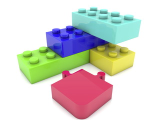 Puzzle piece near toy bricks