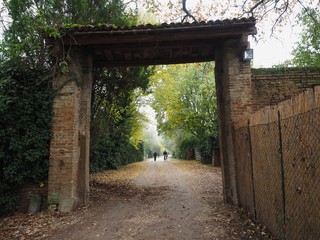  Country road with large brick portal.