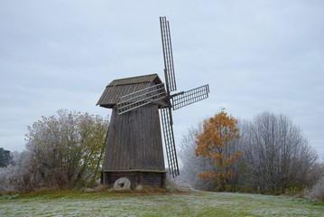 Old wooden mill close up in the cloudy October afternoon. Mikhaylovskoye, Pushkin Hills. Russia