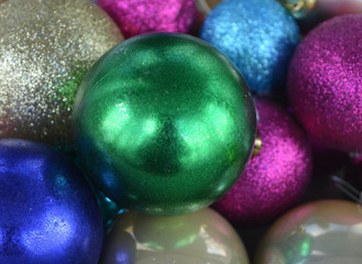 bright multicolored christmas balls, festive background, texture