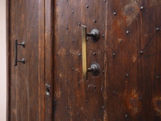 Fototapeta premium Old wood door with big handles.