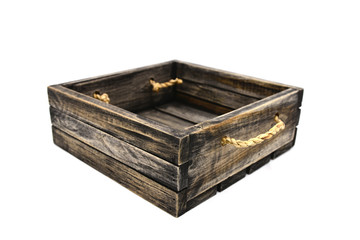 Empty retro dark brown wooden box with rope on white background