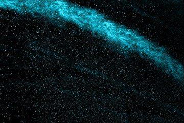 abstract blue powder splatted on black background.