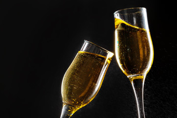 glass of champagne on black background