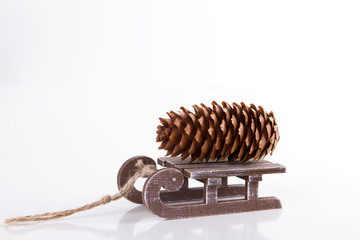 pine cone on the sled