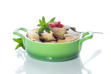 sweet dumplings with cherries in a bowl