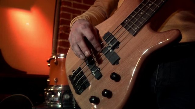 Rock musician plays solo on electric guitar. Playing hands on rock guitarist