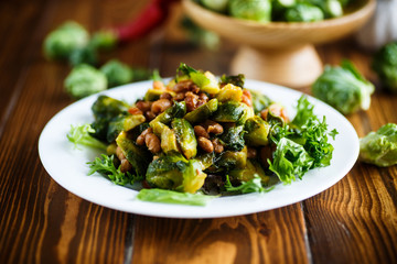 Brussels sprouts fried with beans close-up