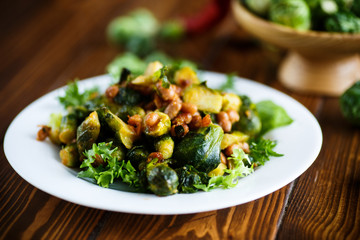Brussels sprouts fried with beans close-up