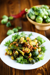 Brussels sprouts fried with beans close-up