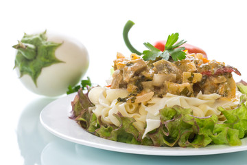 Boiled home-made noodles with gravy from eggplant