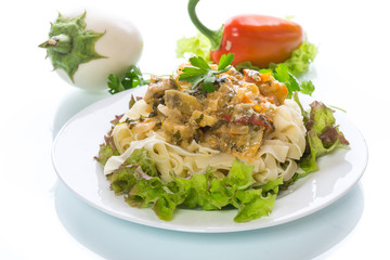 Boiled home-made noodles with gravy from eggplant