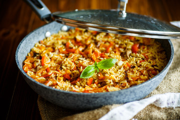 Pilaf with beef, carrots, onions, garlic, pepper and cumin.