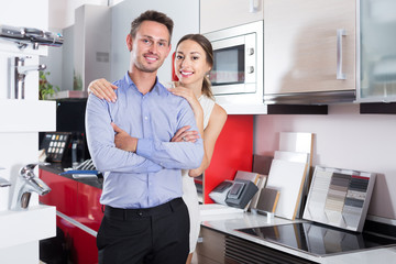 Couple looking at modern kitchen