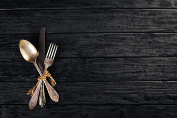 Cutlery. Vintage On a wooden background. Top view. Free space for text.