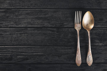 Cutlery. Vintage On a wooden background. Top view. Free space for text.