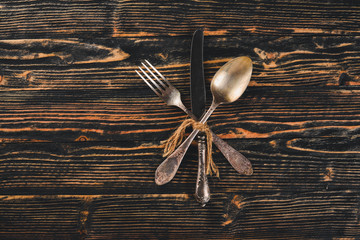 Cutlery. Vintage On a wooden background. Top view. Free space for text.