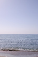 Beautiful blue sea and cloudless sky, vertical view