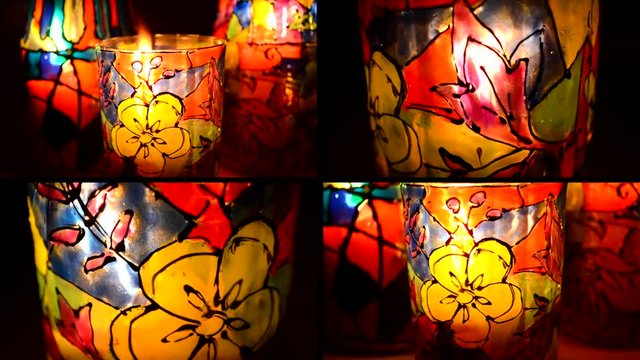 4 in 1. Candle flame shines in colorful candlestick closeup. Candle light through glass candlestick, painted with colorful design. Multicam split screen group video wall collage montage seamless loop.