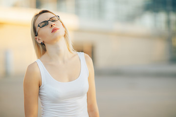 Business woman wearing glasses with a frustrated expression of the face