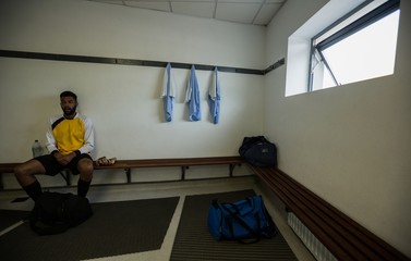 Player relaxing in changing room