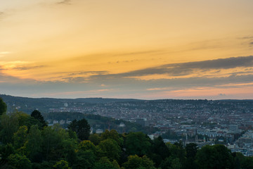 Wide view over the roofs of the city of stuttgart from above at beautiful sunset
