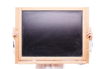 Boy holding black textured chalkboard with copy space isolated on white background