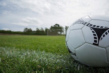 Fototapeta na wymiar Soccer ball on white marking line