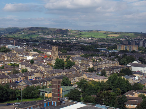 panoramic ariel view of halifax town in west yorkshire with the pennines in the background