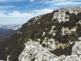 mountain view on the peak, skyline clouds forest, valley, rocks