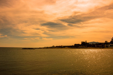 Sunset beach. Beautiful sunset view. Puerto Banus, Marbella city, Costa del Sol, Andalusia, Spain.