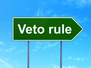 Politics concept: Veto Rule on green road highway sign, clear blue sky background, 3D rendering