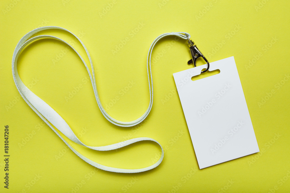 Poster blank badge mockup isolated on yellow. plain empty name tag with string.
