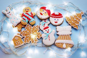 Christmas gingerbread cookies on blue background