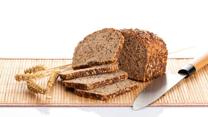 Sliced  bread on cutting board. knife and bread