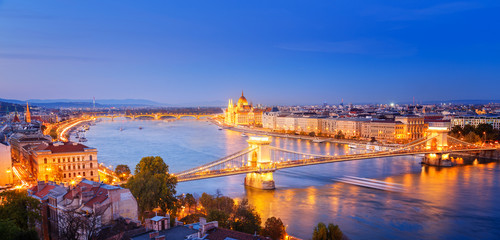 Budapest, panoramic view from above, night scenery, city lights glowing, Danube river delta scenic curved. Budapest is popular and famous European travel destination.