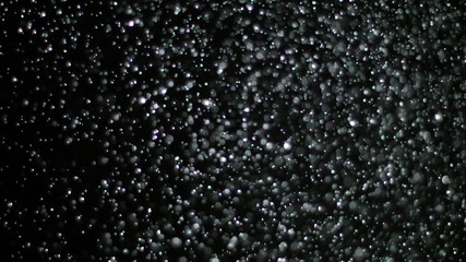 Snowfall Bokeh Lights on Black Background, Shot of Flying Snowflakes in the Air