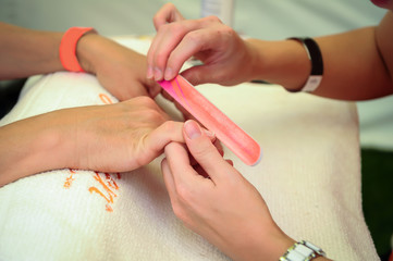 Obraz na płótnie Canvas woman nail manicure in salon
