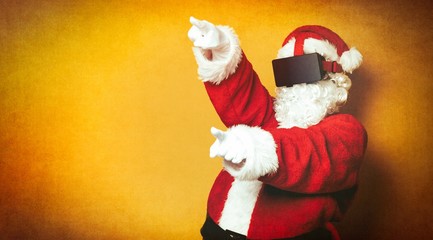 Funny Santa Claus have a joy with VR glasses