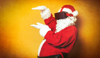 Funny Santa Claus have a joy with VR glasses