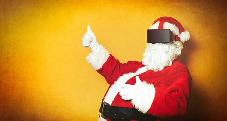 Funny Santa Claus have a joy with VR glasses