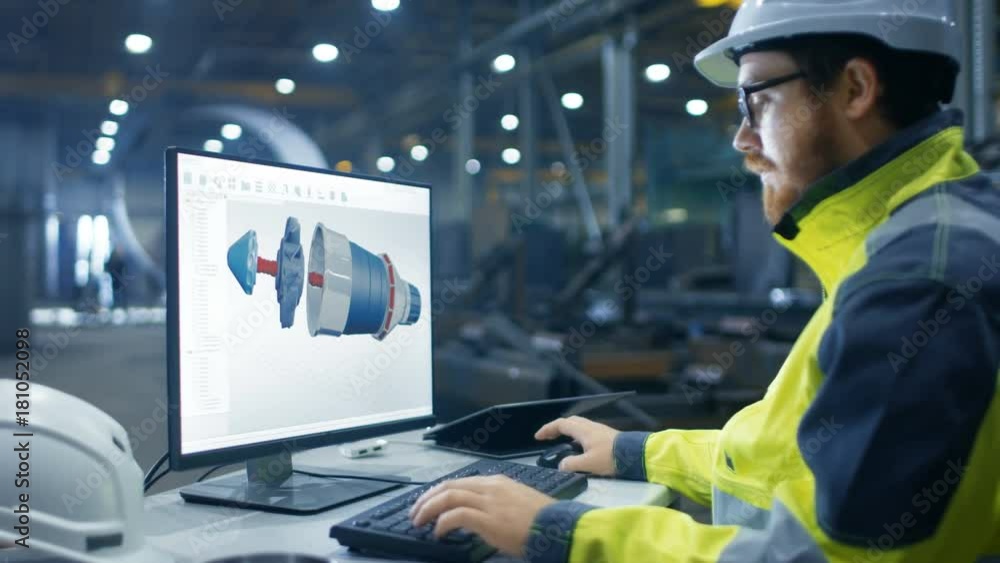 Poster inside the heavy industry factory industrial engineer works on the personal computer designing turbi